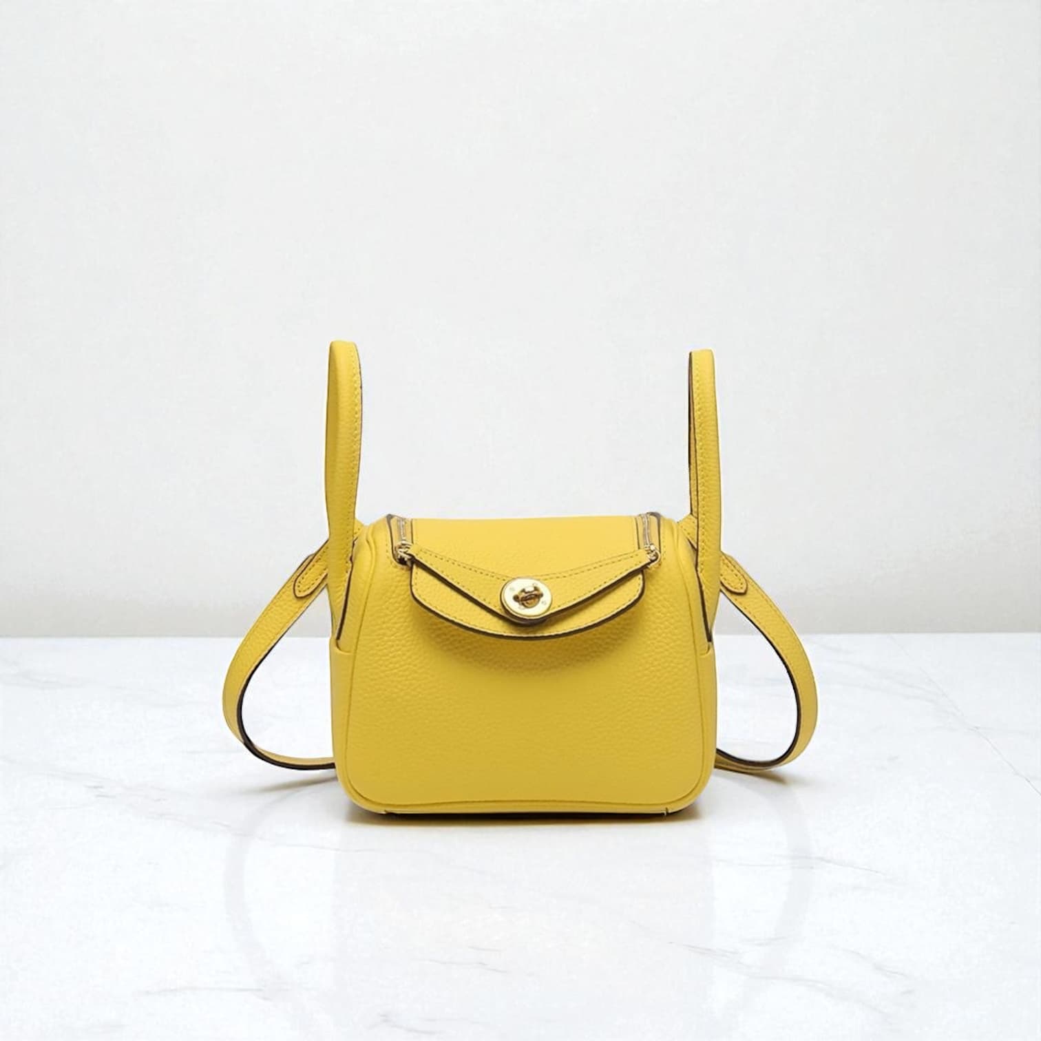 212 牛革RDバッグ/Sサイズ イエロー / 高級感を演出するゴールド金具